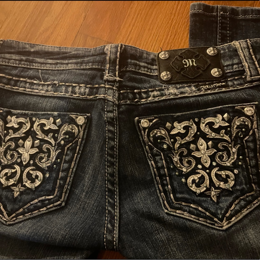 Miss Me Jeans. Size 26. These truly are not for a young lady with any hips.